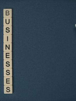 Conceptual image of supporting small businesses with financial resources using money and letter tiles.